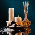 Aromatherapy oils and candles create a relaxing massage atmosphere.
